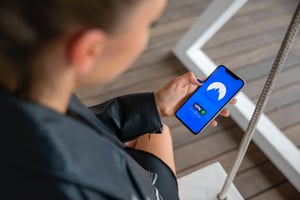 a woman on her phone accessing a VPN.